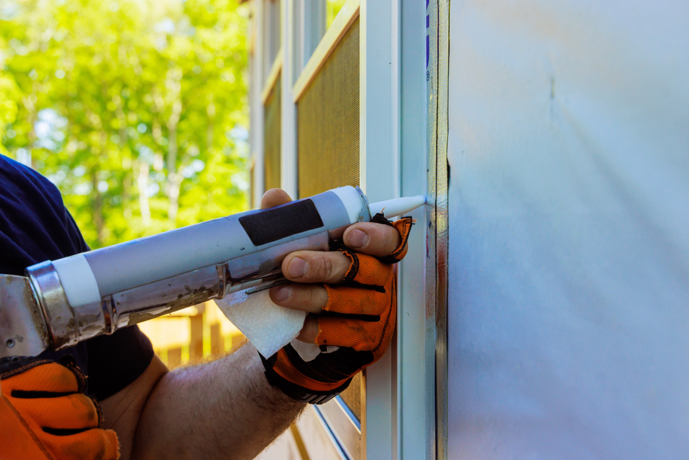 Technician installing window in Canadian home