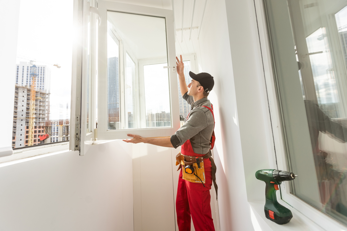 Technician repairing window for humidity control