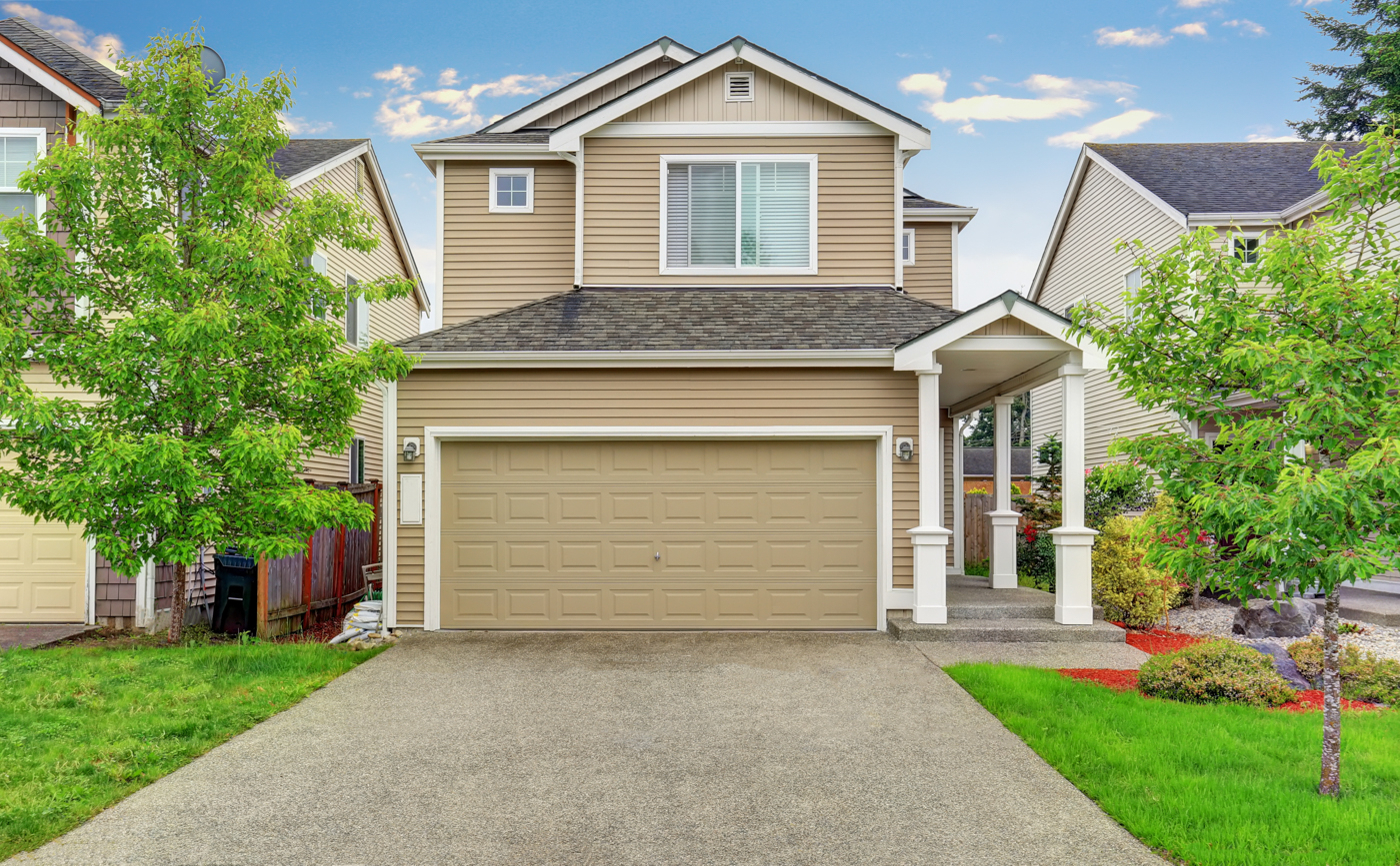 Modern wood garage door on Canadian home driveway