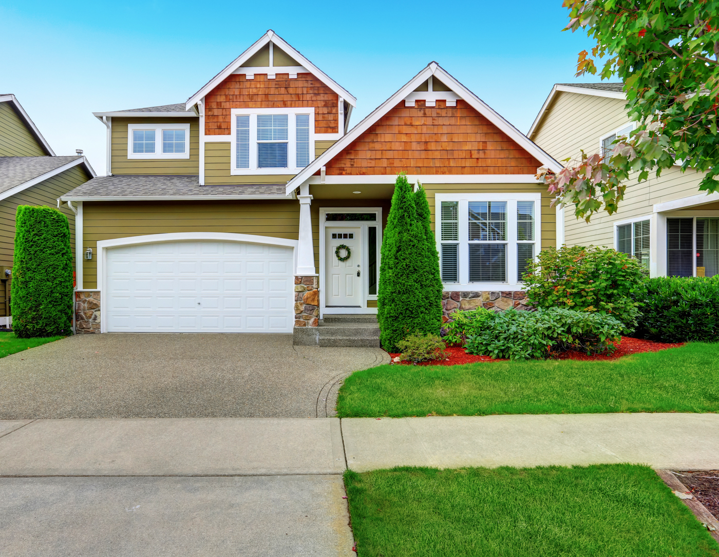 Triple residential garage doors on Canadian home