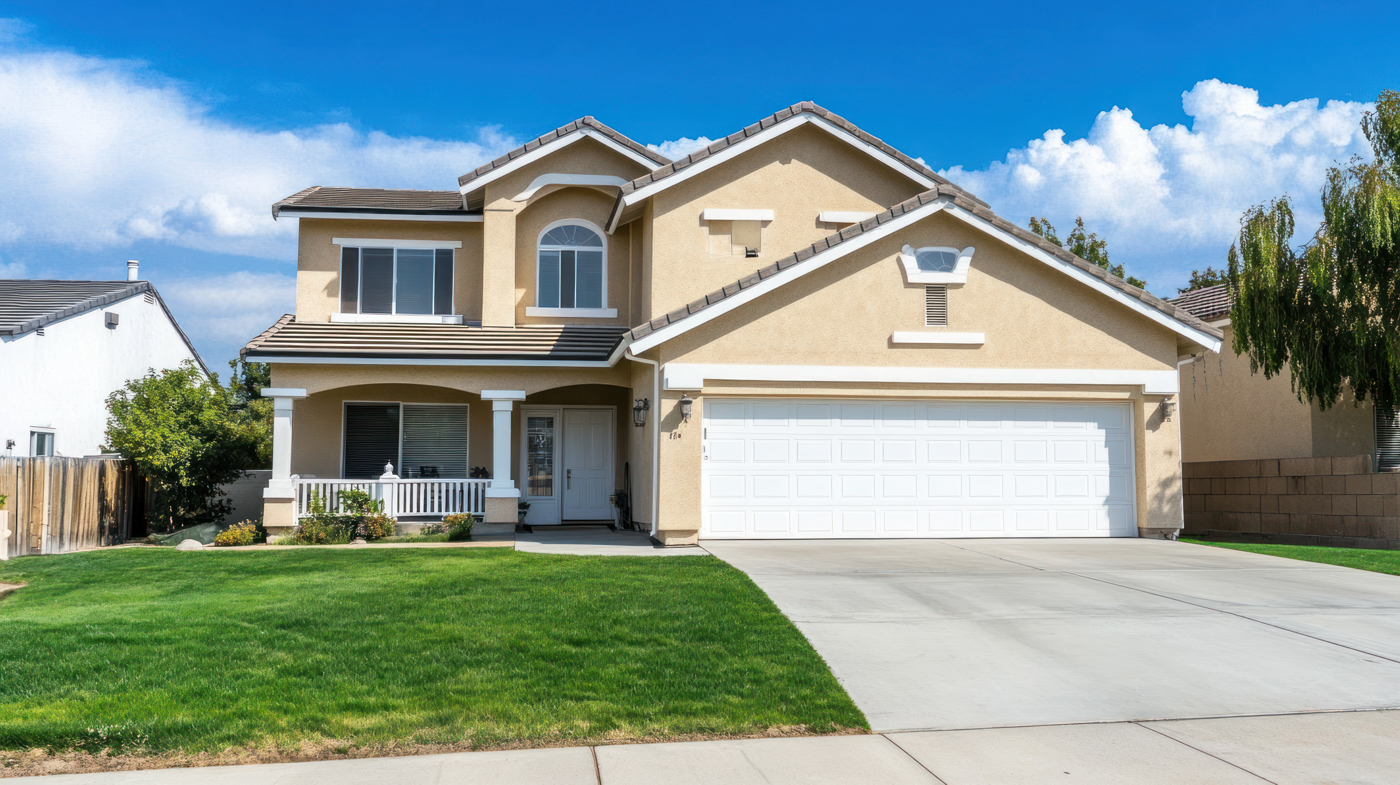 White residential garage door on Canadian home driveway
