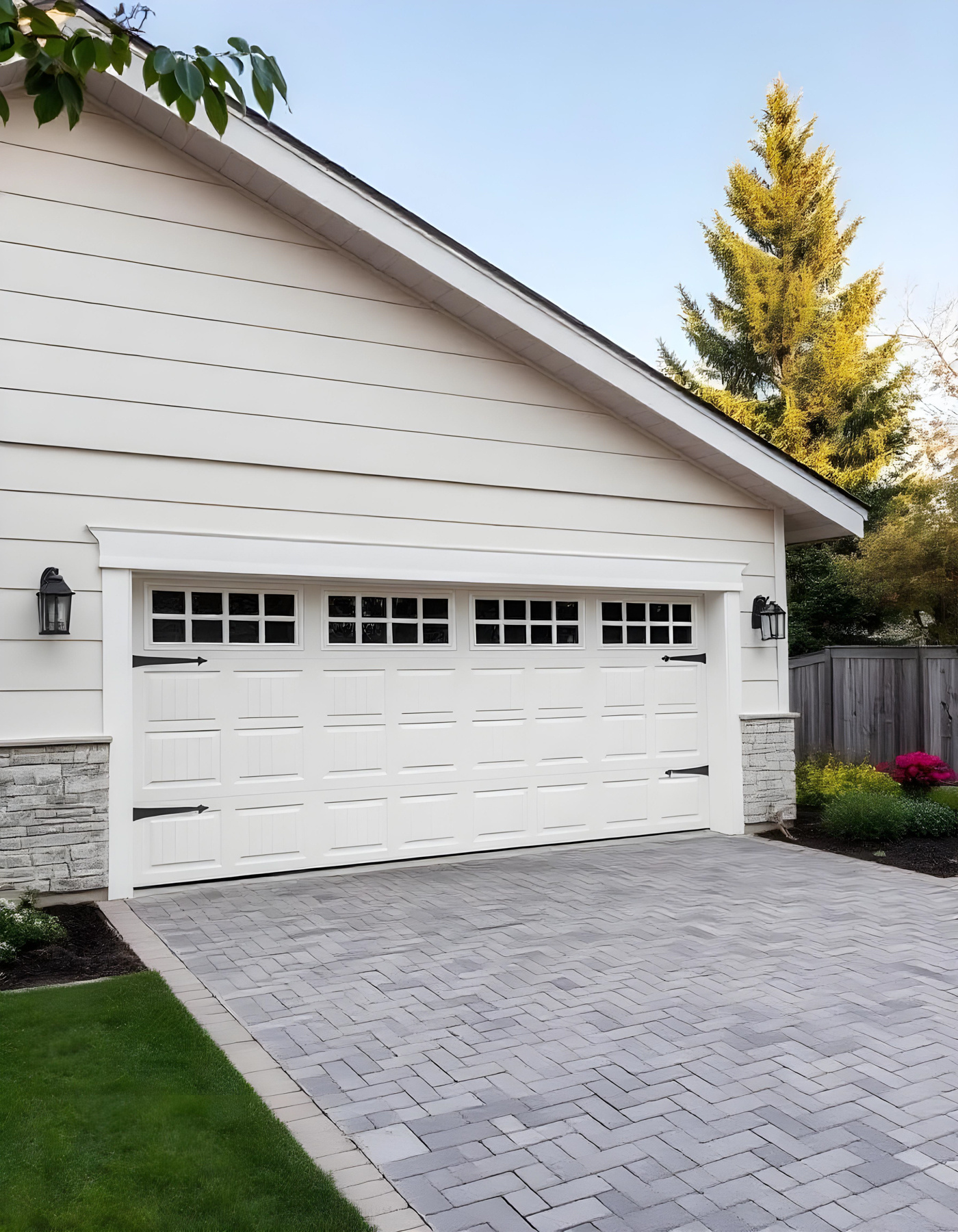 Modern white residential garage door with windows