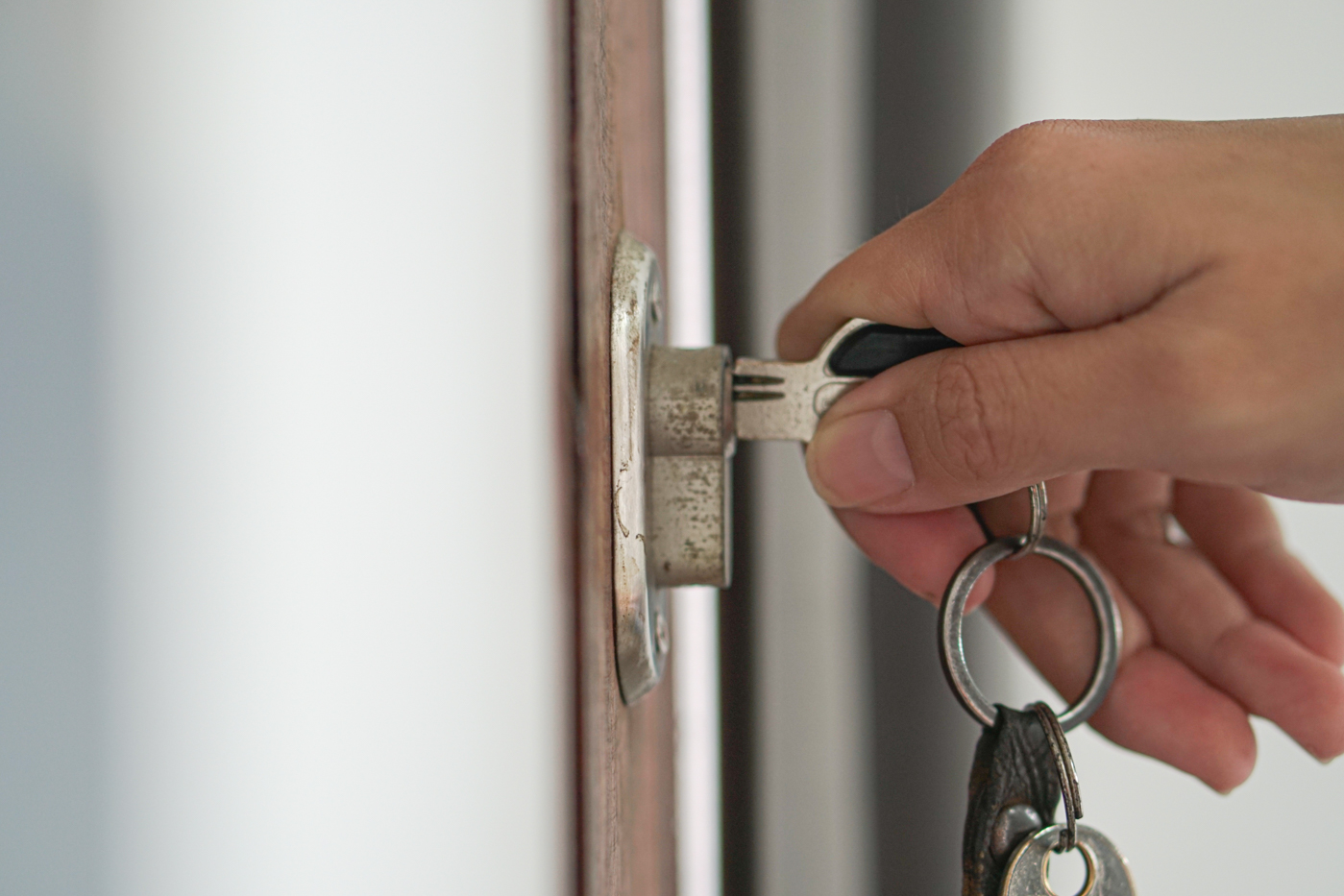 Lock repair on damaged door by locksmith expert