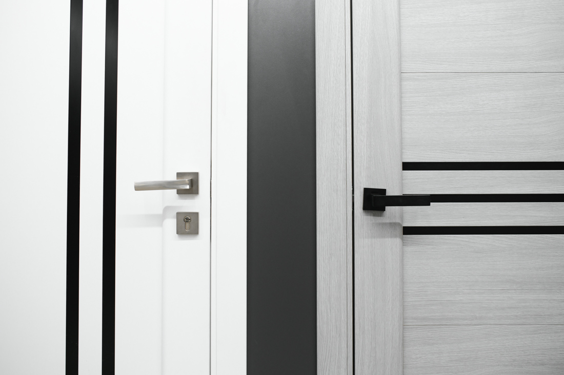 Locksmith installing door lock